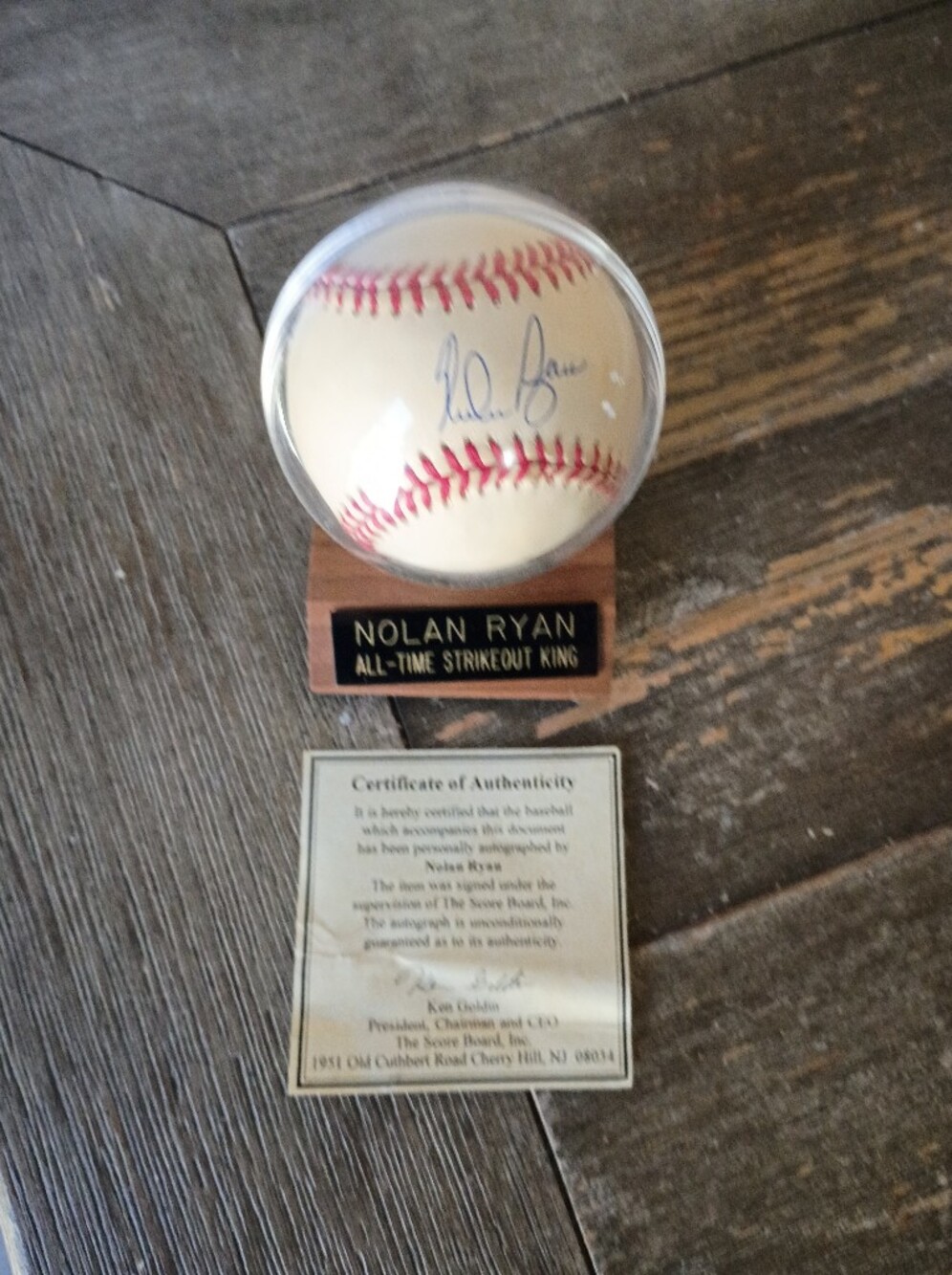 Nolan Ryan Autographed Baseball Display With COA- Cream Baseball with Wood Stand